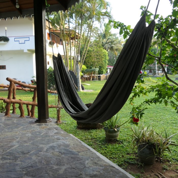 Private terrace of the medium bungalow with hammock and garden view